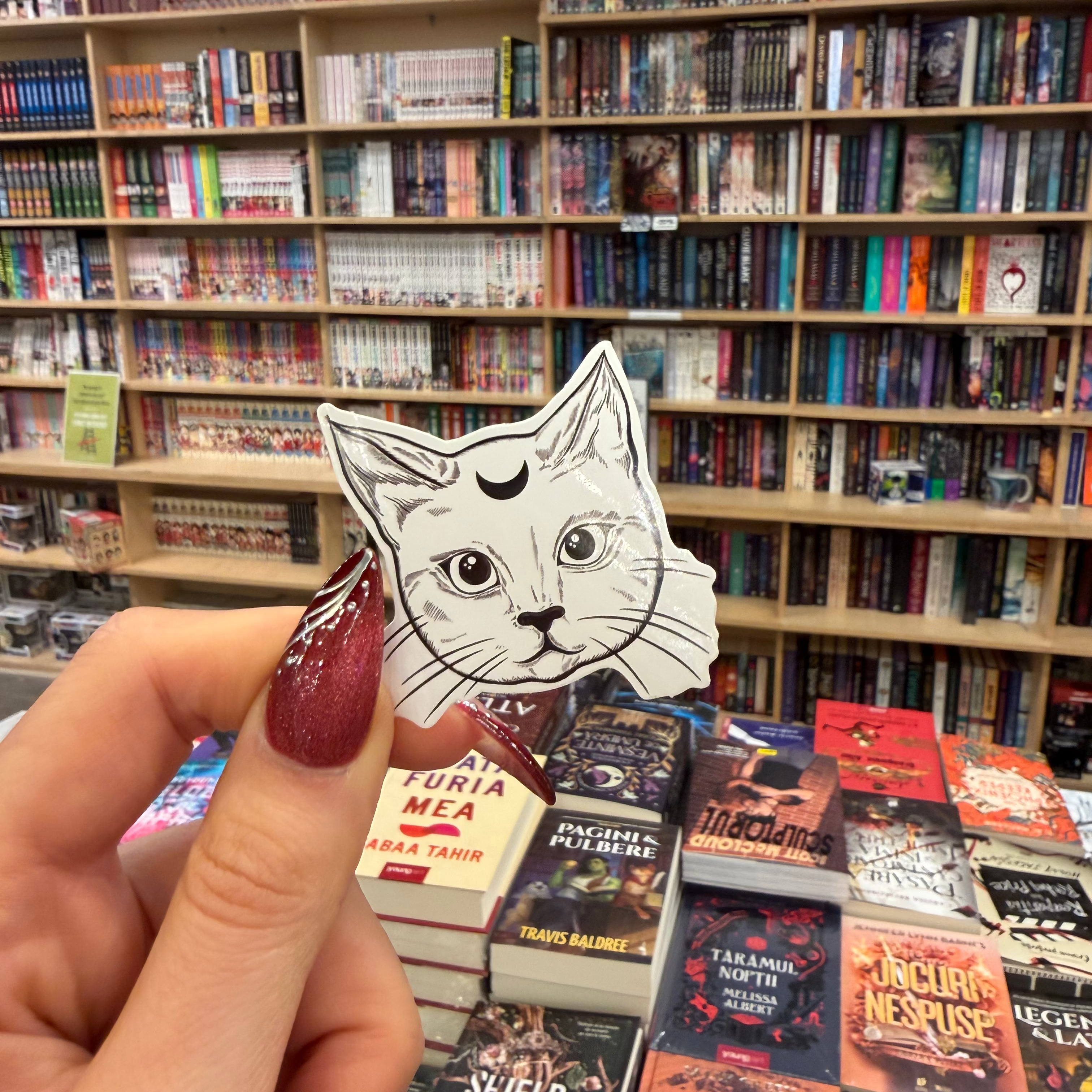illustrated sticker depicting a mystical cat familiar 