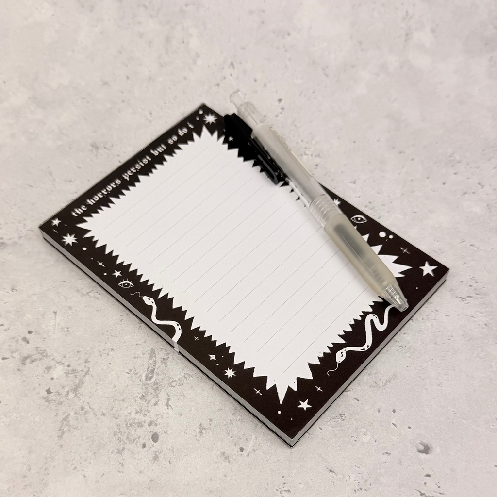 Rectangular mirror with decorative border on a textured gray surface