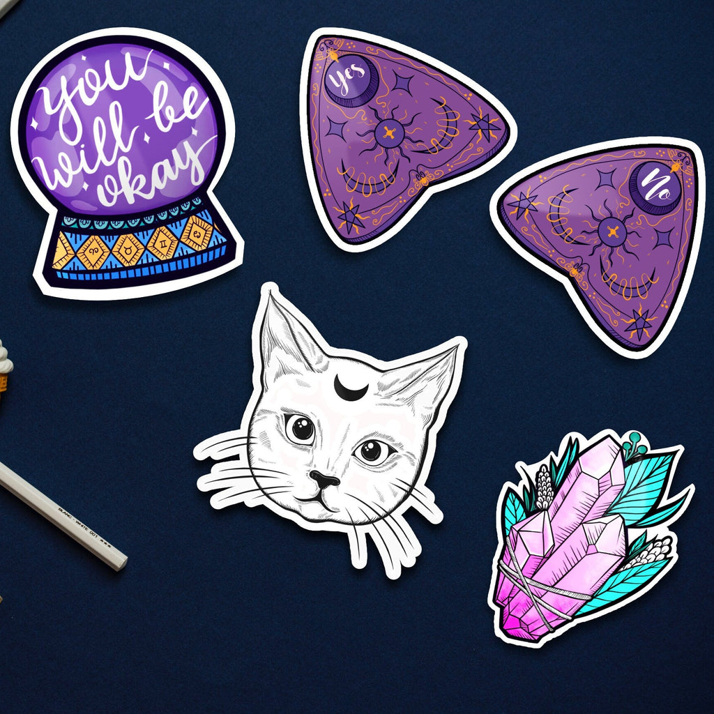 Set of colorful stickers on a dark blue background with stationery items.